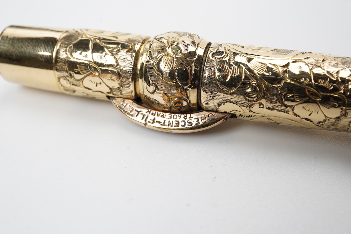 A Conklin ring top hand engraved crescent filler fountain pen with 14ct. gold Conklin flexible nib